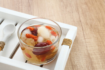 Peach Gum, Chinese traditional drink that contains peach gum, bird nest, red dates, snow fungus, goji berry, and rock sugar. 

