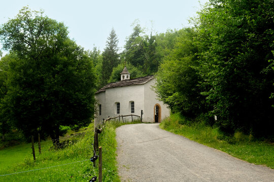 Selective focus picture with noise effect added of small church on the hill. at the jungle in Ballenberg.