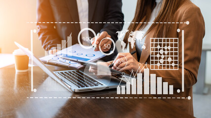 Team colleagues wear formal attire to work together to optimize business processes by using new technologies. high tech hologram in office