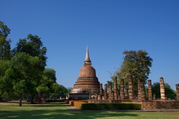 Old chedi and blue sky in Sukhothai Historical Park, Thailand