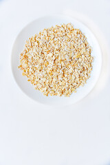 Oatmeal close-up on a white background