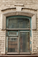 Fototapeta na wymiar An old wooden window in an old house