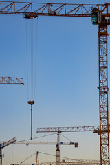   construction crane against the blue sky