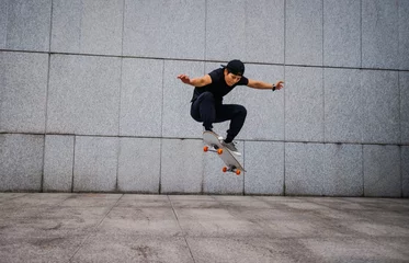 Gordijnen Asian woman skateboarder skateboarding in modern city © lzf