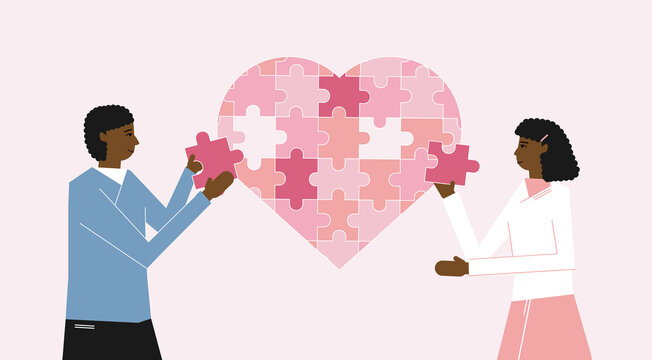 African American Couple Assembling Heart Symbol From Puzzle Pieces. Love, Togetherness And Romance Concept. Young Loving Couple Standing And Forming Huge Heart Puzzle From Pieces Together