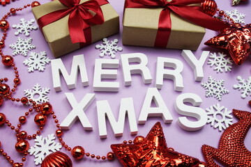 Fototapeta na wymiar Merry XMAS alphabet letters with Christmas decorate on purple background