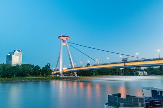 Bratislava, Slovakia - May 31, 2022: Most SNP (Bridge of the Slovak National Uprising) known also as UFO Bridge, Novy most or New Bridge at dusk.