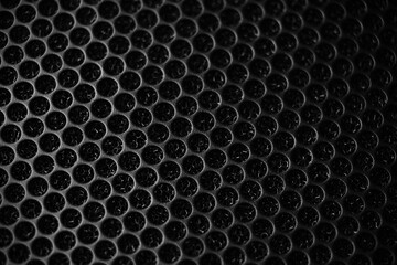 Safety net on the music speaker. Protective grid audio speakers. Close view of Black safety net. Metal perforated mesh, abstract pattern, Abstract black background. Professional audio equipment