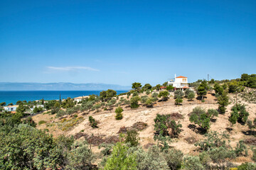 Fototapeta na wymiar Mediterranean Greek landscape in sunny summer day