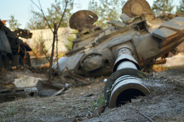 Close-up of the tank gun of the destroyed military equipment of the Russian army following the Ukrainian force's counter-attacks in the Kiev region, Ukraine.