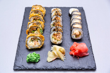 Sushi set grilled in tempura  on the stone plate