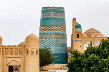 Kalta Minor minaret and city walls in Khiva, Uzbekistan, Central Asia