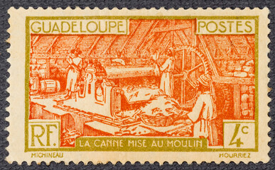 GUADELOUPE - CIRCA 1928: stamp printed in Guadeloupe shows Sugar Refinery, circa 1928