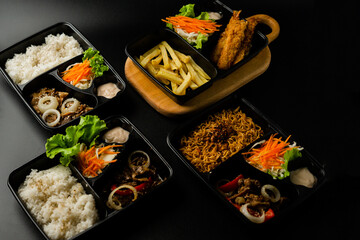 japanese bento set with dark background, asian food.