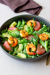 Salad with shrimp, grapefruit, avocado and nuts. Healthy eating. Diet.