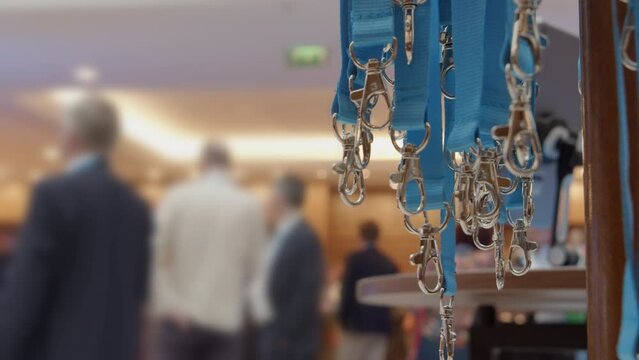 Lanyards are available for business conference attendees. Close-up shot