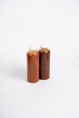 Teriyaki and yakiniku bbq sauce on bottle without brand, white background isolated