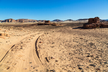 Road on the sand leading to Navamis is a complex of stone structures in the Sinai Desert, Egypt