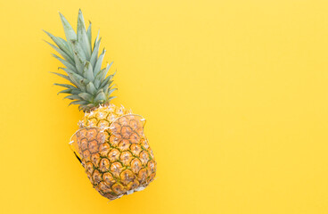 Hipster pineapple with sunglasses against a yellow background