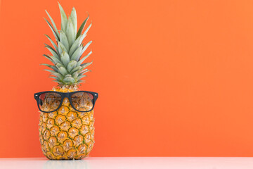 Creative pineapple with sunglasses isolated on color background, summer vacation beach idea design pattern, copy space close up