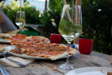 delicious italian pizza and mint liqueur on the table