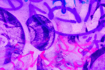 Closeup of colorful pink, purple, blue urban wall texture. Modern pattern for wallpaper design. Creative modern urban city background for advertising mockups. Grunge messy street style background