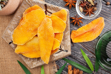 dry mango on wood background top view
