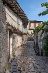 Fototapeta na wymiar Street view in Dimitsana, a picturesque mountain village, built like am amphitheatre, surrounded by mountain tops, Arcadia, Peloponnes, Greece.