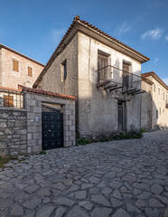 Street view in Dimitsana, a picturesque mountain village, built like am amphitheatre, surrounded by mountain tops, Arcadia, Peloponnes, Greece.