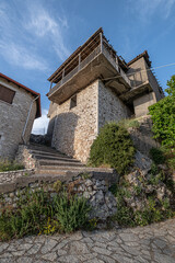 Street view in Dimitsana, a picturesque mountain village, built like am amphitheatre, surrounded by mountain tops, Arcadia, Peloponnes, Greece.