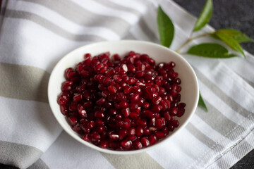pomegranate seeds in a glass bowl