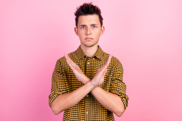 Man over isolated pastel background making stop gesture cross arms x with his hands