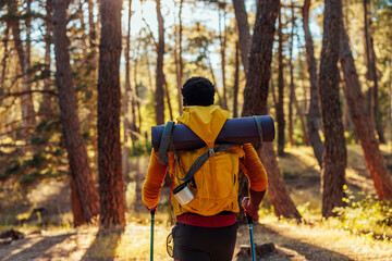 Back shot of hiker with gear