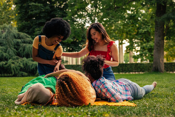 Playful young adult girls in park