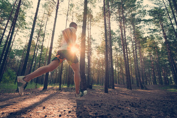 Running man. Male runner jogging at the park. Guy training outdoors. Exercising on forest path. Healthy, fitness, wellness lifestyle. Sport, cardio, workout concept
