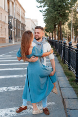 Romantic couple dancing in the street on a sunny summer day in city