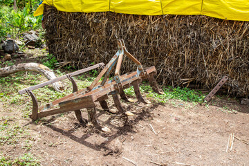 Farm equipment harrow is used to plow the ground soil