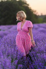 Woman in lavender field at sunset