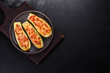 Baked stuffed zucchini boats with minced chicken mushrooms and vegetables with cheese