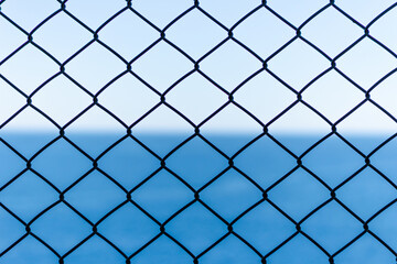 link fence with blue sky