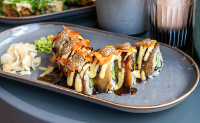 vegan sushi rolls with eggplant chia caviar and sweet potato in a cafe healthy vegetarian food asian cuisine