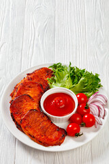 roast slices of pork loin with lettuce and tomato