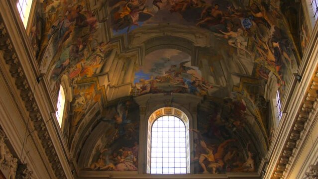 Interior Of Church Of St. Ignatius Of Loyola At Campus Martius With Realistic Painted Ceiling. Roman Catholic Titular Church In Rome, Italy. low angle, tilt-up