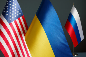 Near the flags of the USA and Ukraine and the flag of Russia.