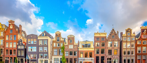 Amsterdam  Panoramic view of famous Amsterdam houses - background isolated on white. Various traditional houses in the historic center of Amsterdam. Amsterdam, Holland, Netherlands - obrazy, fototapety, plakaty