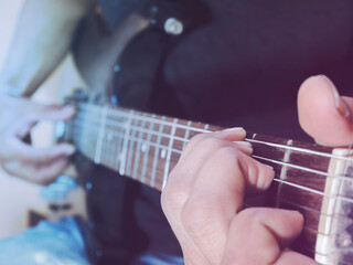 Guitar artist music player rock guitarist how to play chord soft and blur concept background of musician with vintage style colors.