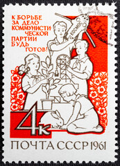 USSR - CIRCA 1961: A stamp printed in USSR shows Children in various activities with inscription In fight for cause of Communist Party, be ready , series International Children's Day , circa 1961