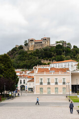 Leiria, Portugal, August 29, 2021: The Paulo VI Square, the Our Lady of the Immaculate Conception Cathedral and Leiria Castle..