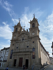 Fototapeta na wymiar Braga, Portugal, October 9, 2021: The Church of Santa Cruz, located in Carlos Amarante Square, is the first great landmark of the so-called Baroque of Braga and one of its highest expressions.