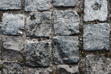 Top view of a tiled cobblestone road in an old historic town